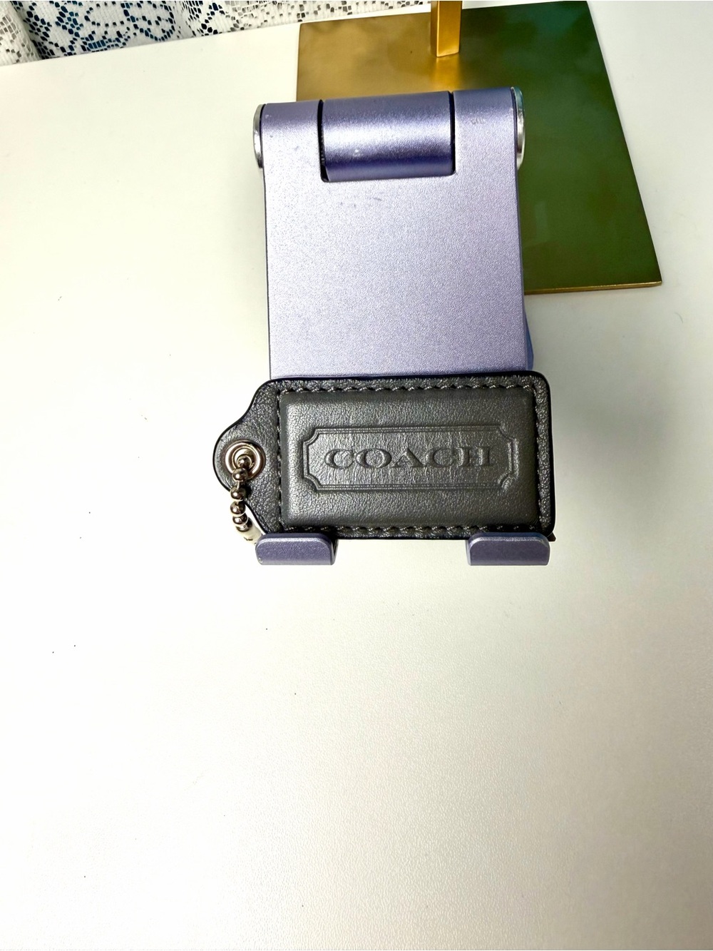 COACH dark gray leather hang tag 1 in H x 2.5 in L